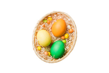 Basket of colorful Easter eggs isolated on white background. Easter basket filled with colored eggs top view holiday concept