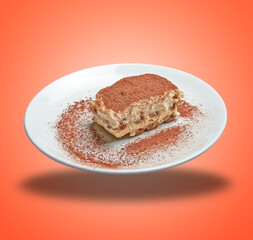 Floating White plate with sweet italian dessert tiramisu
