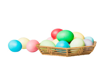 Basket of colorful Easter eggs isolated on white background. Easter basket filled with colored eggs top view holiday concept