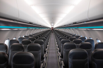 Commercial passenger aircraft interior with empty seats
