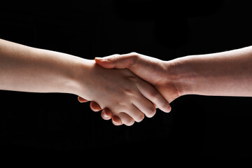 two people's hands are making a handshake gesture
