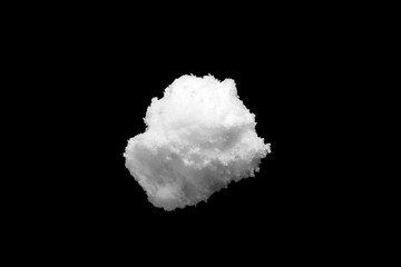 White snow isolated on black background close up
