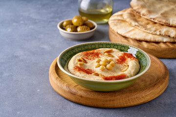 Traditional middle eastern dip hummus with olive oil. Closeup