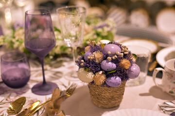 Obraz na płótnie Canvas Easter table decor in purple.
