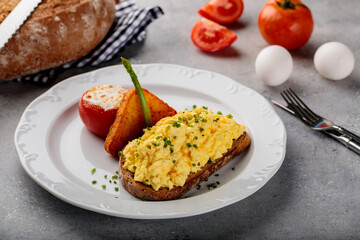 Eggs your way with bread and tomato served in dish isolated on table top view of arabic breakfast