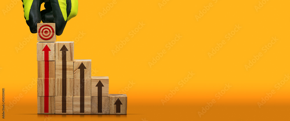 Poster gloved hand arranging wood blocks as step stair with a target symbol on the last step and red and br