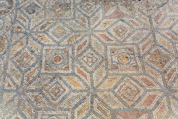 Archaeological remains with decorative tile floors and frescoes paintings in a hillside house on the slopes of the ancient city ruins of Ephesus, Turkey near Selcuk. Close up fragment