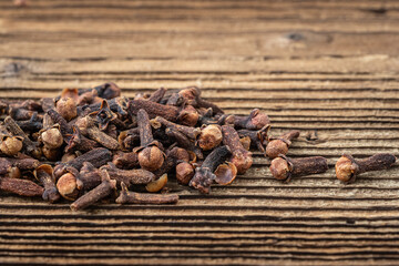 Clove spice on a wooden board, Syzygium aromaticum