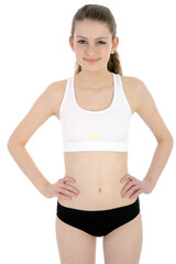 Fototapeta na wymiar Sporty teenage girl posing in sportswear in studio, isolated on white