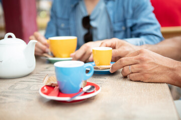 couple hands on table with cup of coffee espresso