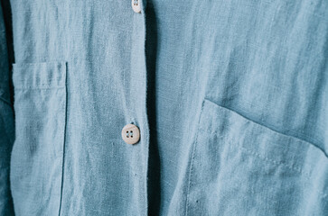 Close up aqua linen shirt with wooden button