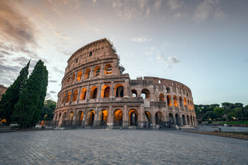 Amazing view of the Colosseum at beautiful warm light at sunrise, Rome, Italy..