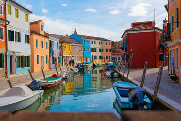 Fototapeta na wymiar Burano Italy Spring Colorful Houses Sea Boat Sun Venice