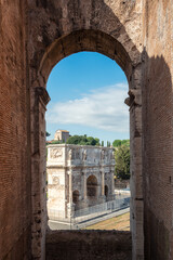 Amazing view of the Arch of Constantine (Arco di Costantino) from the upper floors of the Colosseum, Rome, Italy. - obrazy, fototapety, plakaty