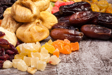 Dried fruits on wooden background in studio photo