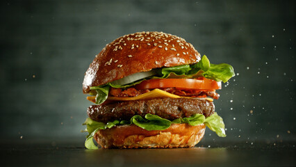 Delicious fresh cheeseburger with old grey background.