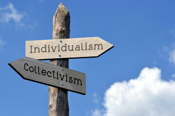 Individualism and collectivism - wooden signpost with two arrows, sky with clouds