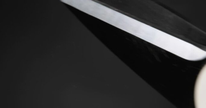 Cutting twine for festive packaging on a black background