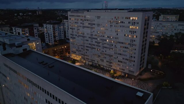 High-rise apartment blocks in Sweden at dusk. Forward drone shot.