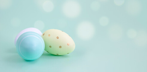 Easter eggs on a blue background, front view. Copy space.