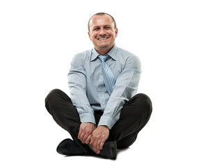 Happy mature businessman sitting with his legs crossed