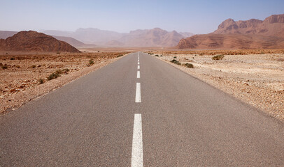 Fototapeta na wymiar Asphalt road in the desert, Morocco