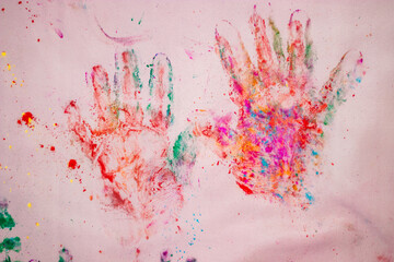 holi celebration hand print with colors from flat angle