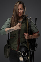 Fototapeta na wymiar Portrait of brown haired woman mercenary in setting of post apocalypse.