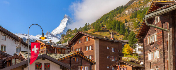Matterhorn snow mount close-up and Zermatt alpine houses, Switzerland, Swiss Alps banner - obrazy, fototapety, plakaty