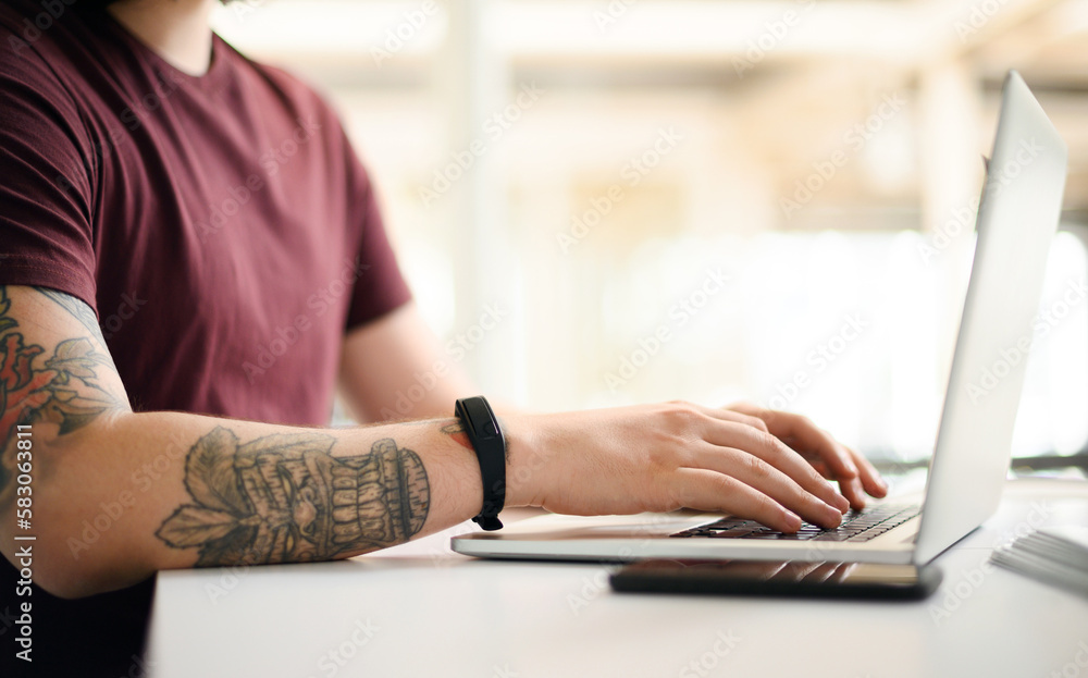 Poster Making moves towards success. Closeup shot of an unrecognisable businessman working on a laptop in an office.