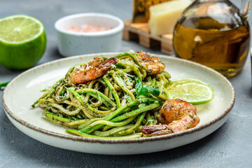 zucchini pasta shrimp with basil pesto sauce. Healthy fats, clean eating for weight loss. place for text, top view