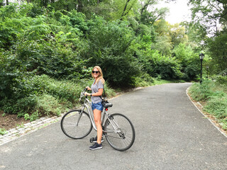 Naklejka premium woman tourist riding a bike