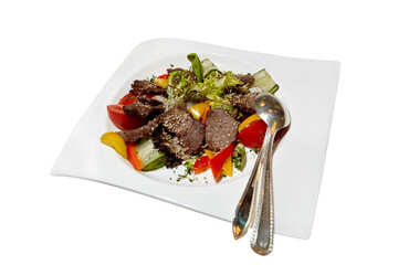 Sliced grilled beef steak with green leaves salad, cucumbers, tomatoes, bell peppers and sesame seeds on a white plate. Barbecue steak and healthy salad, top view, isolated