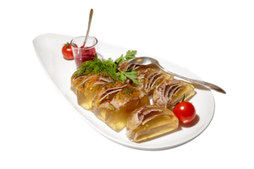 Aspic meat on a white plate. Portioned slices. Isolated