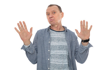 Serious, concerned sixty year old man grimace on his face lifting palms and shaking hands...