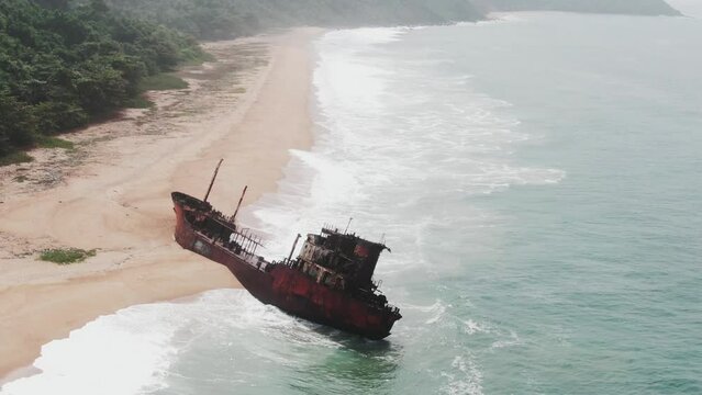abandoned shipwreck stranded on a long coastline near Robertsport, Liberia