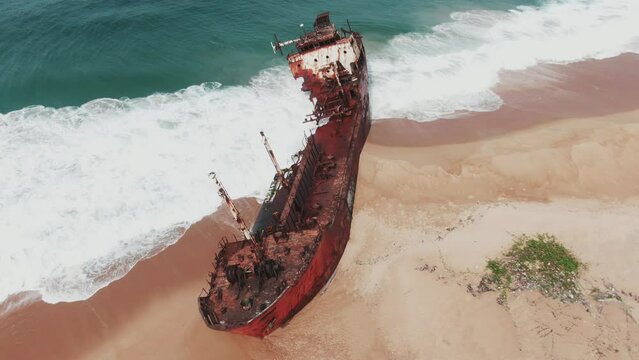 a rusty shipwreck on the west african coast in Robertsport, Liberia