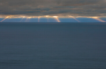 Bright rays of sun coming through the clouds