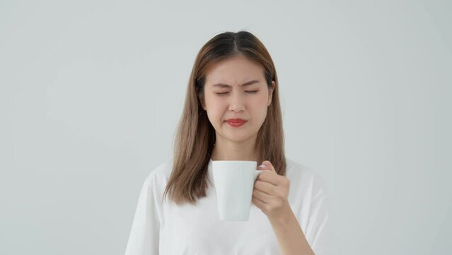 Asian woman feel sensitive teeth after drinking hot, female suffer tooth, decay problems, dental care, tooth extraction, decay problem, bad breath, Gingival Recession, Oral Hygiene instruction