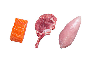 Set of raw meat steaks salmon, beef veal and turkey on a kitchen table.  Isolated, transparent...