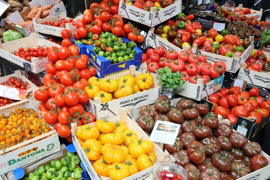 LONDON, UK - APRIL 22, 2016: Tomato varieties at Borough Market in Southwark, London. It is one of oldest markets in Europe. Its 1,000th birthday was in 2014.