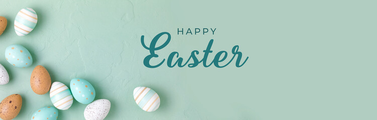 Happy Easter Greetings Banner -  English text.  Easter frame of pastel colored eggs on light green...