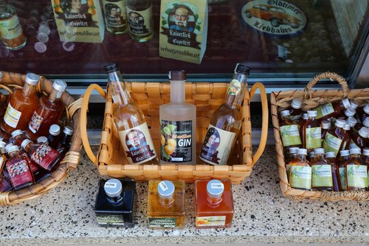 MELK, AUSTRIA - AUGUST 1, 2022: Apricot schnaps and gin for sale in Melk, Wachau region of Austria. Wachau region is famed for its apricot artisanal products.