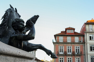 Detailed view of the bronze sculpture of a fountain in a square in Porto, Portugal