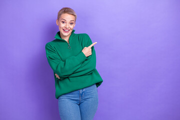 Photo of excited overjoyed girl wear green zipper fleece jacket indicate finger mockup crazy season...