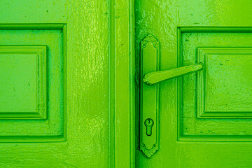 old green door with handle