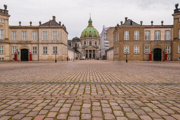 Fototapeta na wymiar The view of Frederick’s Church and Amalienborg Palace, the residence of the Danish royal family, in the center of Copenhagen, Denmark