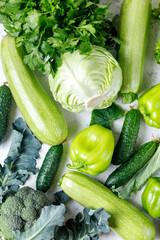 Variety of green vegetables background. Top view of healthy organic food