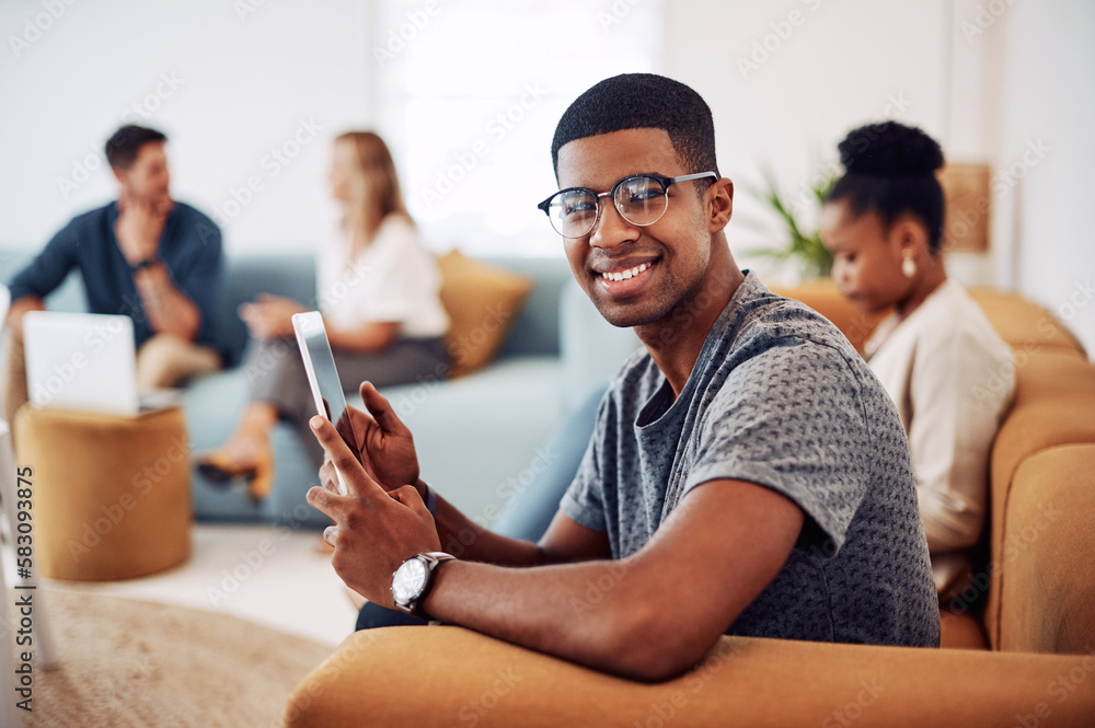 Poster technology runs this generation. cropped portrait of a handsome young businessman sitting and using 