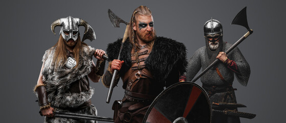 Portrait of furious vikings barbarians dressed in chainmail and fur.